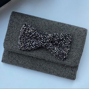 silver beaded bow clutch